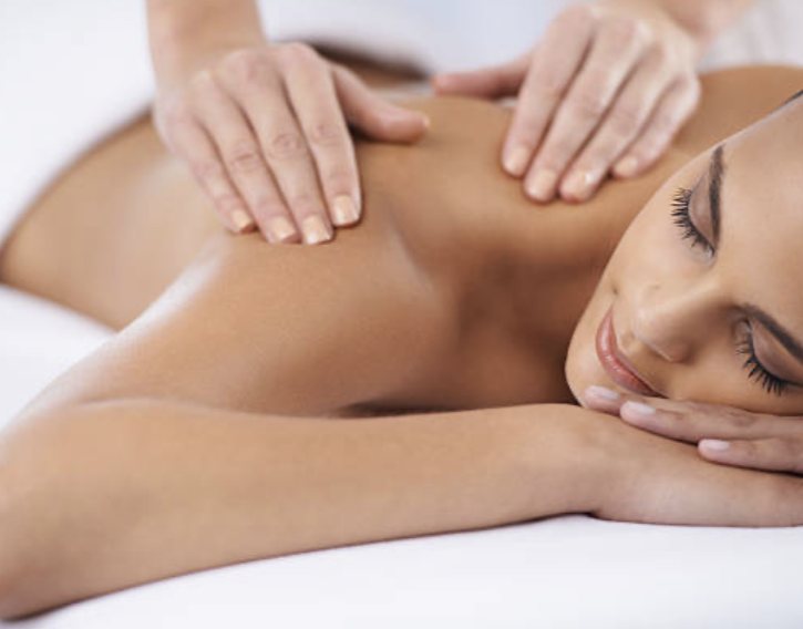 Firm, focused massage across the upper back and shoulders
